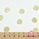 Knoflík kulatý, lesklý s vyrytým ornamentem kytičky žlutý